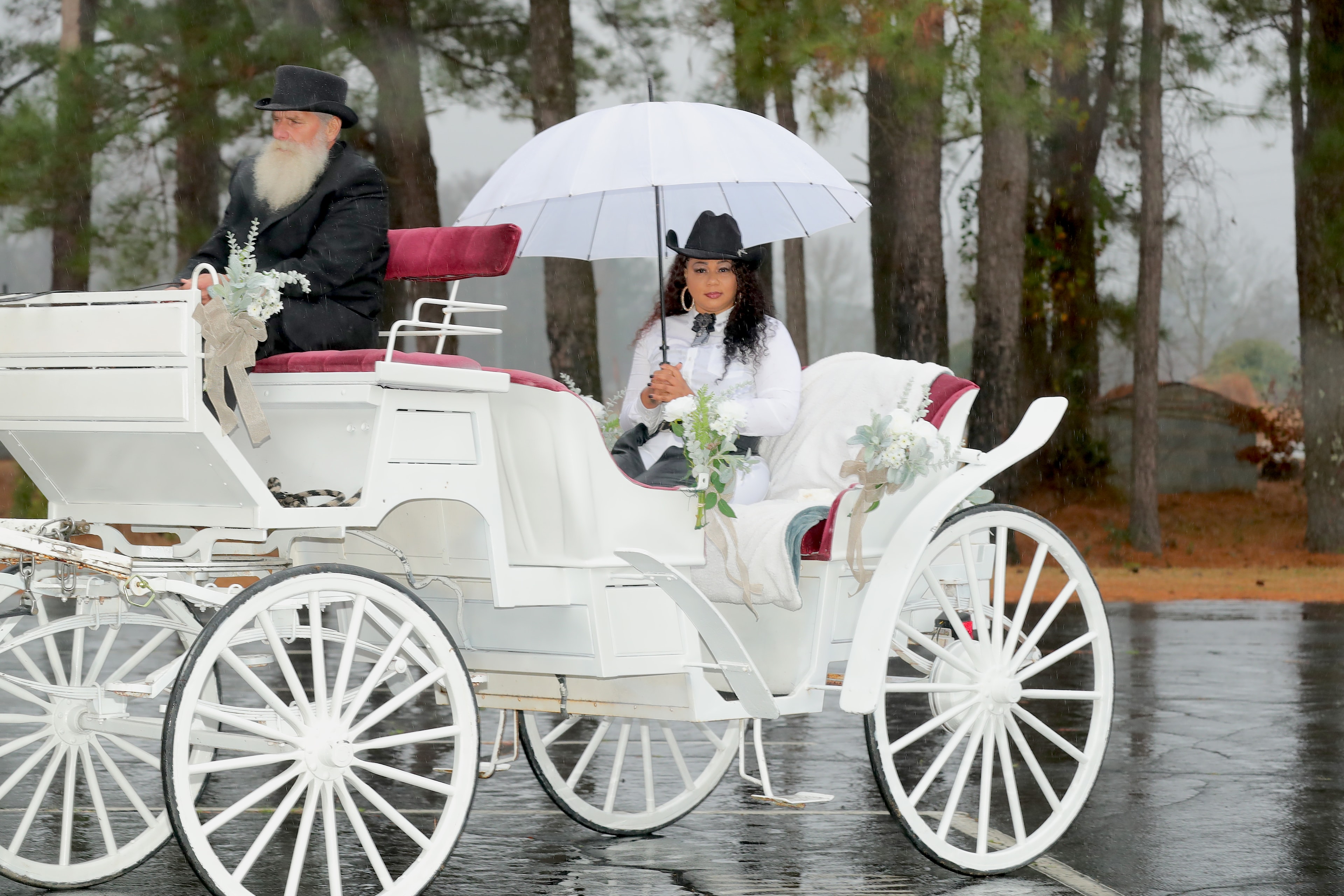 Carriage ride with bride and groom in period attire